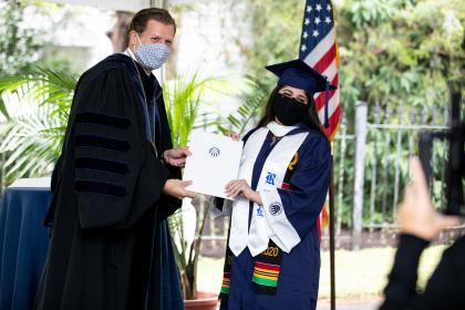 Class of 2020 graduate with President Reveley at the small personal graduation recognition ceremony